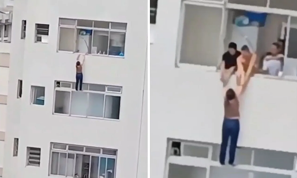 Mulher é resgatada por moradores após escorregar e quase cair de prédio em SP