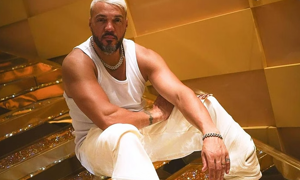 Amigo de Belo afirma que cantor tentou comprar fuzil de traficantes