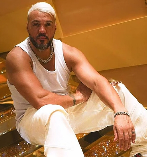 Amigo de Belo afirma que cantor tentou comprar fuzil de traficantes